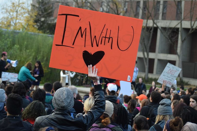 A student holds a sign that reads "I'm with u." The walk out was organized by students from a group called the Coalition for Justice, which was formed Friday in response to Trump’s election and his rhetoric.