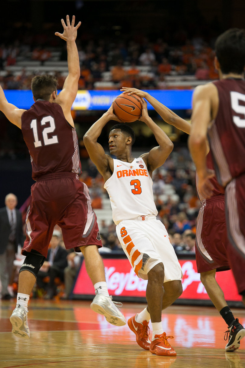 Andrew White III, a 6-foot-7, 210-pound guard, looks to pass against IUP's pressure. 