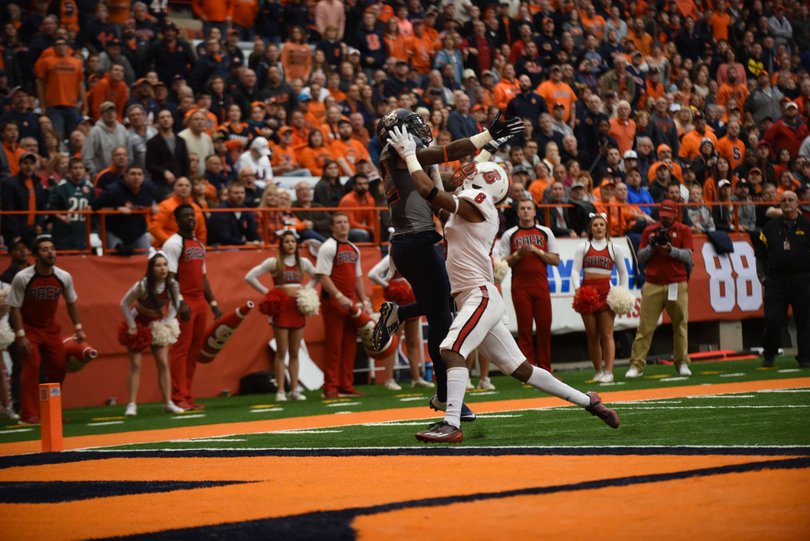 Alvin Cornelius elevates above a Wolfpack defender. He made four catches for 61 yards on the day.