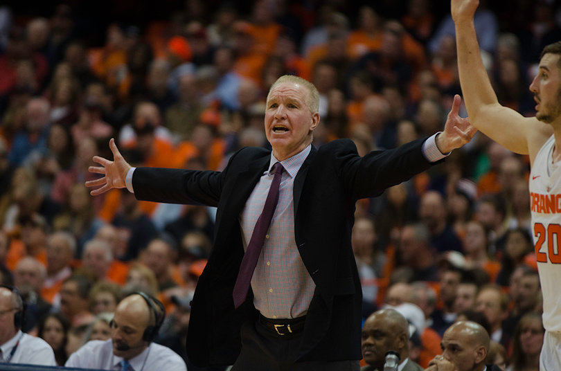 Mullin holds out his arms, motioning to his team. 