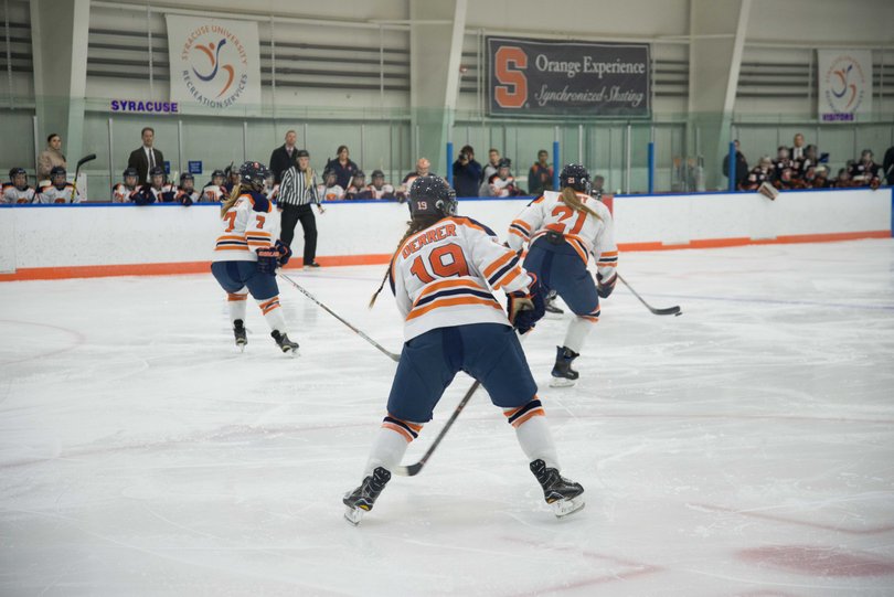 Derrer stands near the circle as Syracuse moves in transition.