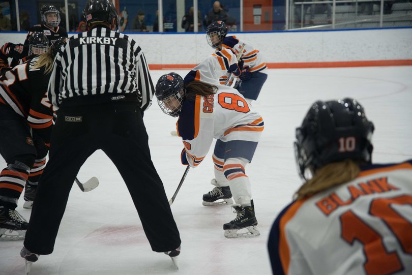 Grossi lines up to take a faceoff.