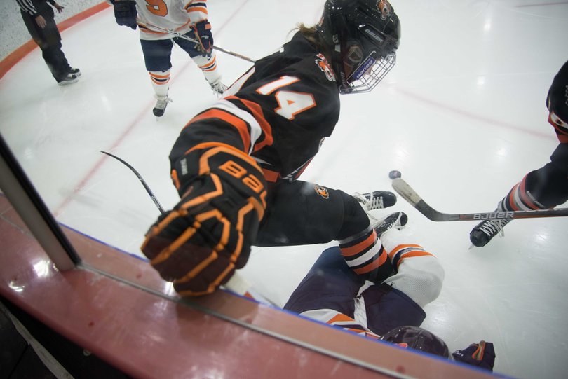 RIT's Mackenzie Stone rests her right hand on the boards. 