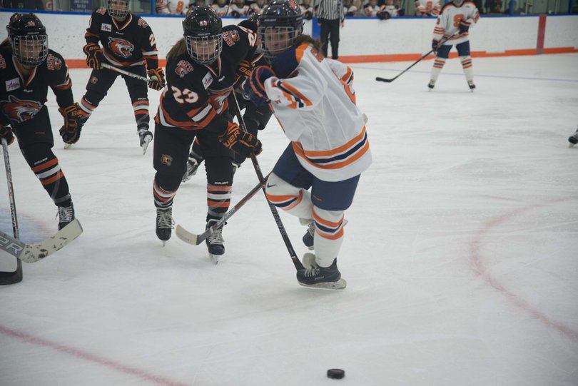SU's Stephanie Grossi skates toward the corner. She took four shots in the tie.