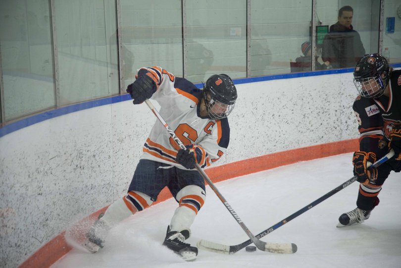 Sibley takes on a defender along the boards.