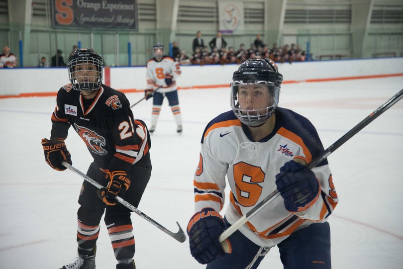 Two players approach the glass in the contest.