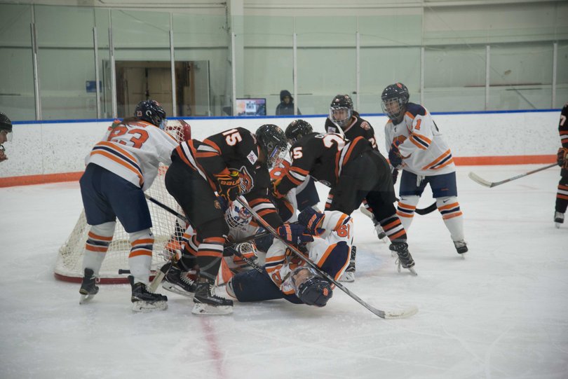 A scrum at the net breaks out. RIT was able to break through SU's defense in the third period.