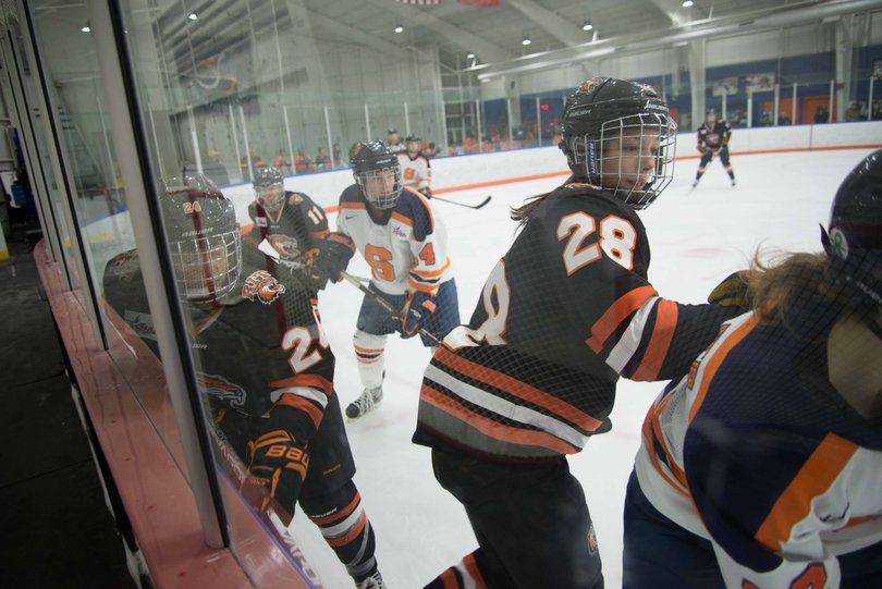Players gather along the boards.