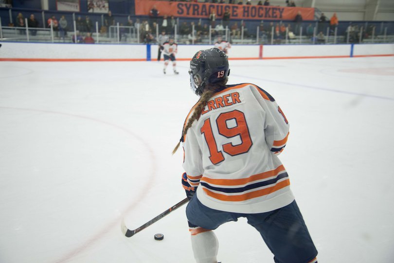The Orange's Dakota Derrer controls the puck. She was called for two penalties in the tie.