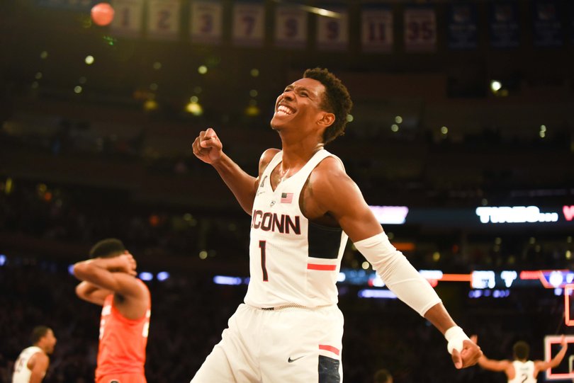 Christian Vital celebrates as Tyus Battle covers his head in the background. Battle fouled Vital with two seconds left and Vital hit the game-winning free throws.