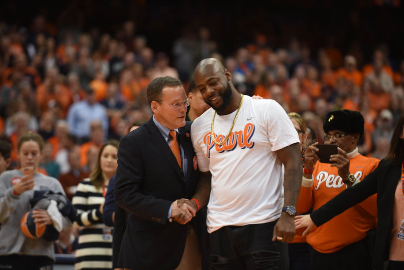 Left: Syracuse Director of Athletics John Wildhack.