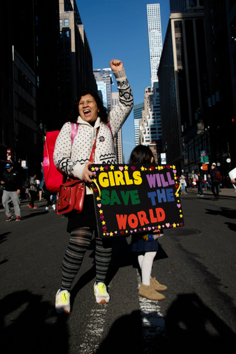 A mother and daughter march in New York City, where about 250,000 protesters gathered.
