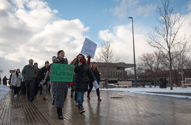 Arva Hassonjee and Nedda Sarshar lead hundreds of students down Syracuse University's promenade on Thursday in a "Rally for Refugees" protest that they organized. The protest wound its way to the Life Sciences building for a sit-in and speakers afterwards. The protesters were rallying against President Trump's immigration policies he enacted since becoming president last month.