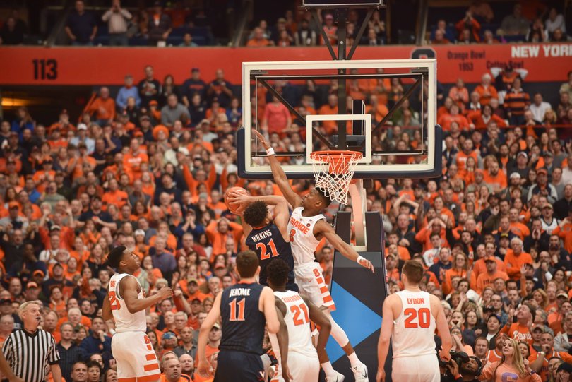 Andrew White goes up to defend a shot of Virginia's Isaiah Wilkins.