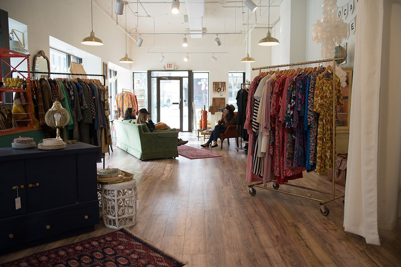 Vintage Love's owners took a modern take with the interior design of the store, mixing hues of green and bubblegum pink. Clothing racks provide pops of texture and color.