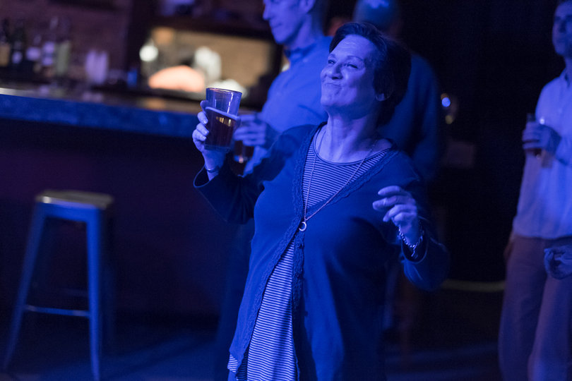 Syracuse resident Joanna Rice enjoys the throwback tunes of Grateful Dead Tribute band Pearly Baker's Best at Funk 'n Waffles Downtown.