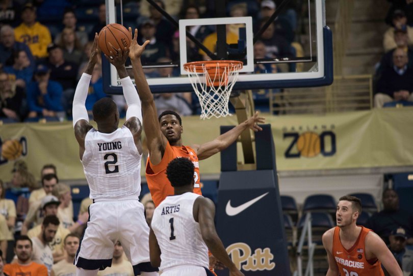 The Panthers' Michael Young elevates for a jump shot over the Orange's Taurean Thompson. Young finished with 21 points.