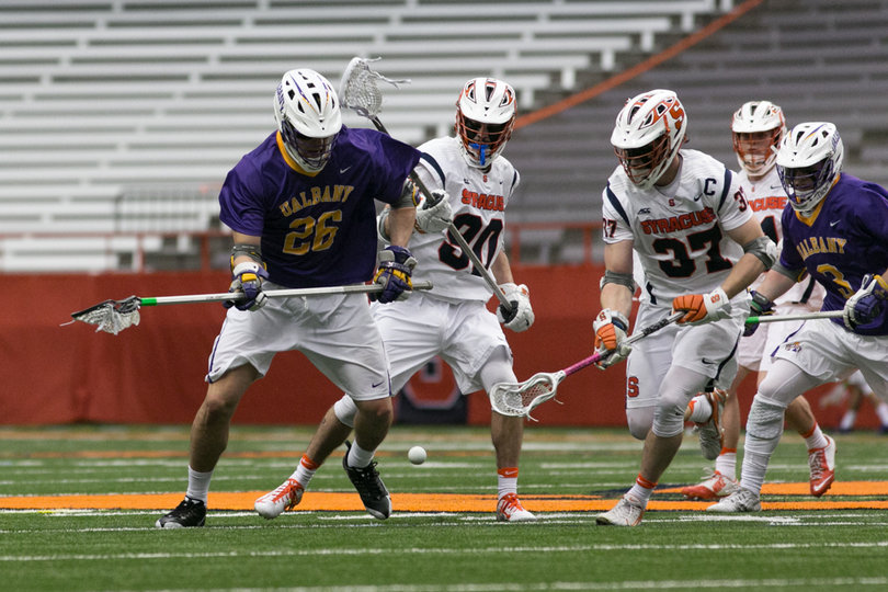 Justin Zelen gets hounded by SU defenders. 