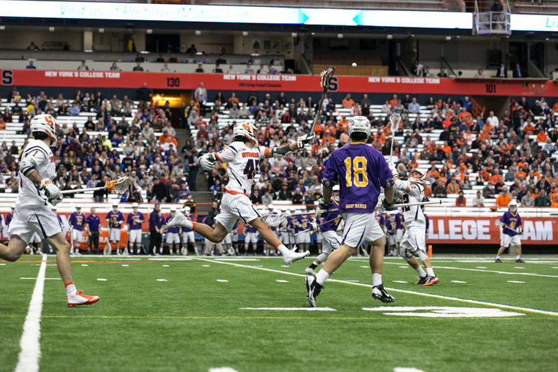 Bomberry puts his stick up to try and stop the ball. 