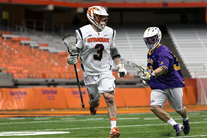 Nate Solomon tries to find space across the crease. 