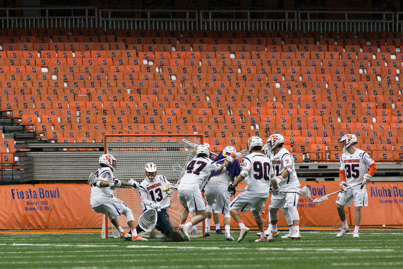Evan Molloy puts his stick down to try and corral the ball. 