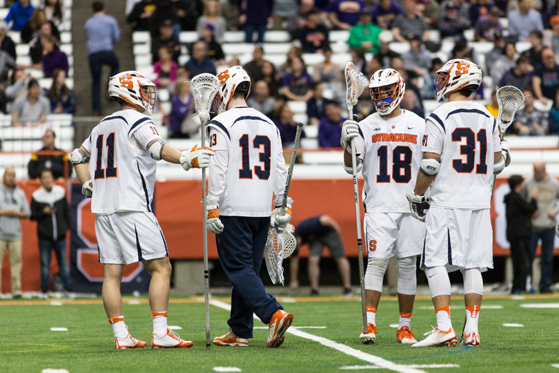 The Orange defense gathers around.