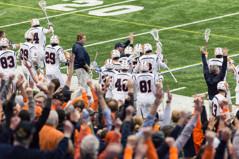 Syracuse's bench celebrates on the sideline.