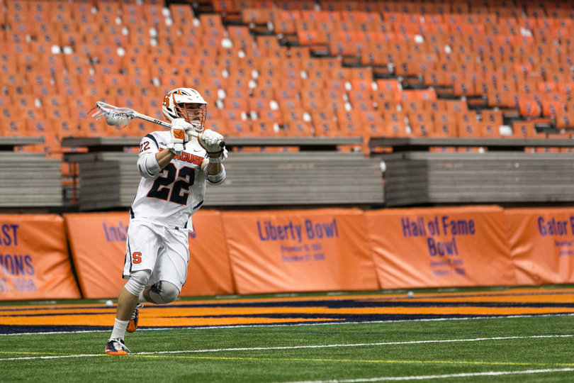 Jordan Evans moves the ball up the field. 