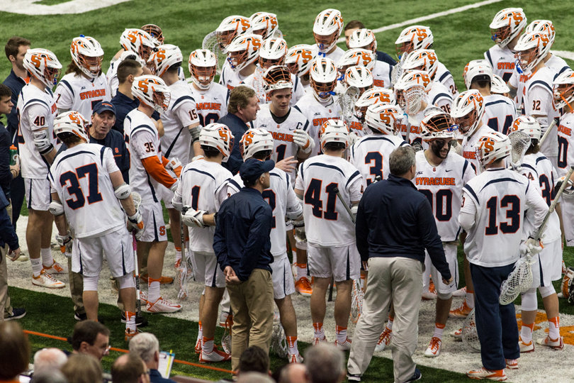 Syracuse's team huddles up on the sideline. 