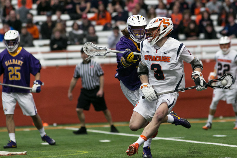 Solomon tries to keep the ball away from an Albany player. 
