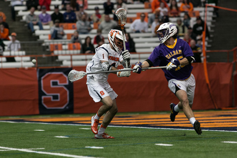 Voigt faceguards an Albany player. 