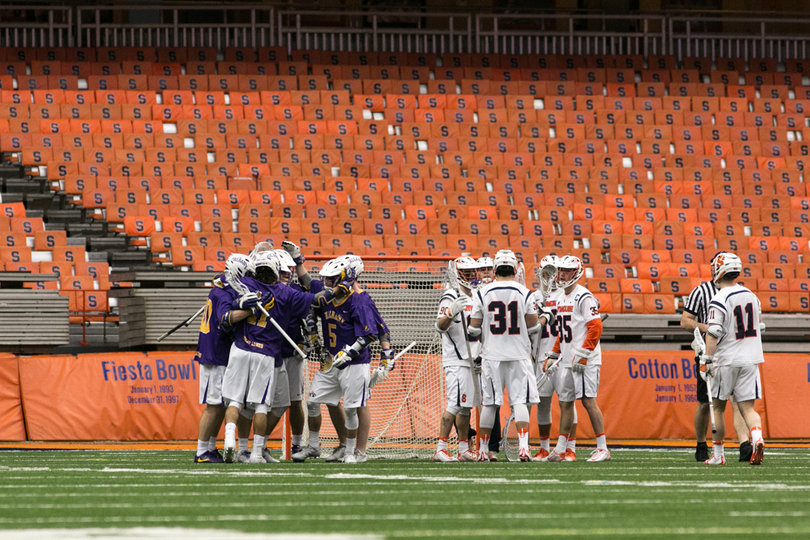 Albany and Syracuse players huddle up. 