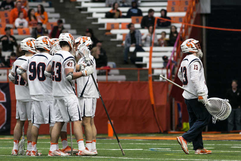 Molloy walks away from his huddling teammates. 