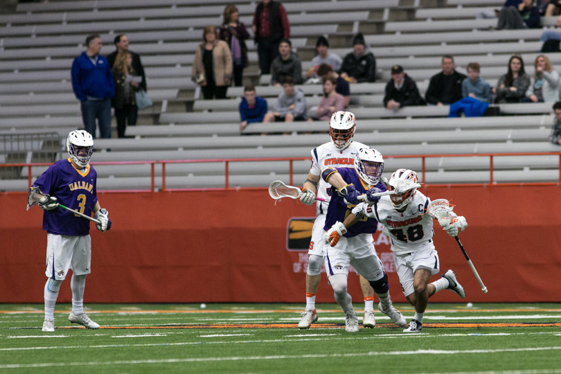Sergio Salcido tries to dodge an Albany player. 