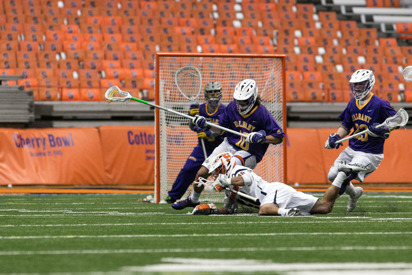 Salcido dives to the ground on a shot. 