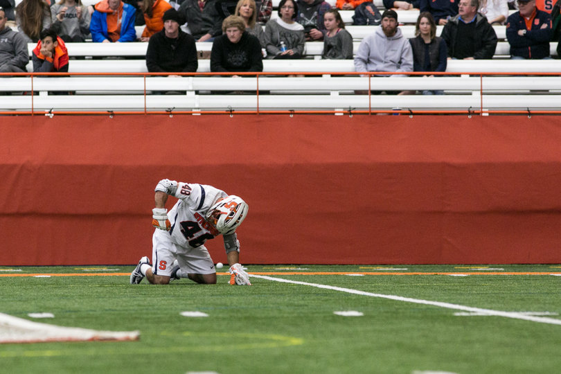 Salcido stays on the ground by himself. 