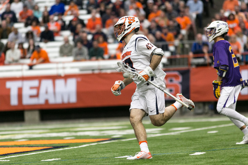 Joe Gillis runs the ball up the field. 