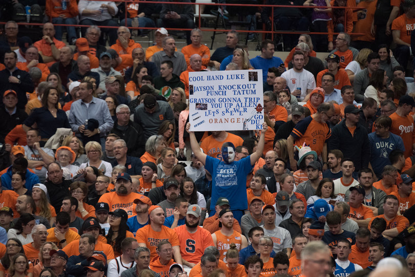Signs scattered throughout the Carrier Dome Wednesday centered on everything from Krzyzewski believing the Earth is flat to Allen tripping puns to rivalry jokes. 
