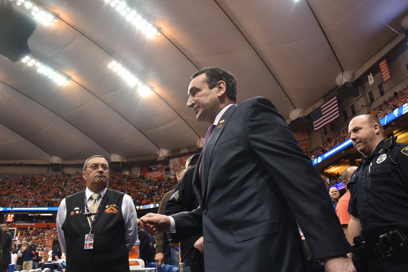 Duke Hall of Fame head coach Mike Krzyzewski walks onto the court before the game against fellow long-time coach Jim Boeheim. 