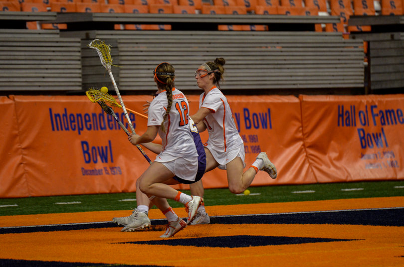 Donahue and Levy collide with an Albany player. 