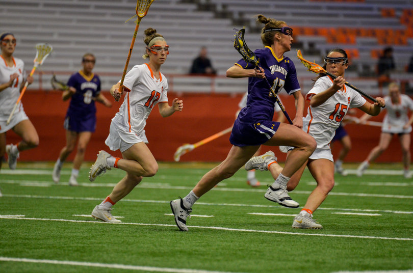 Emily Mizer challenges SU's Natalie Wallon. 