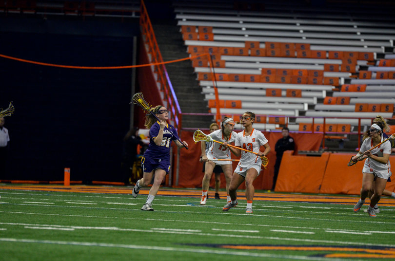 Great Danes middie Sarah Martin looks to pass. 