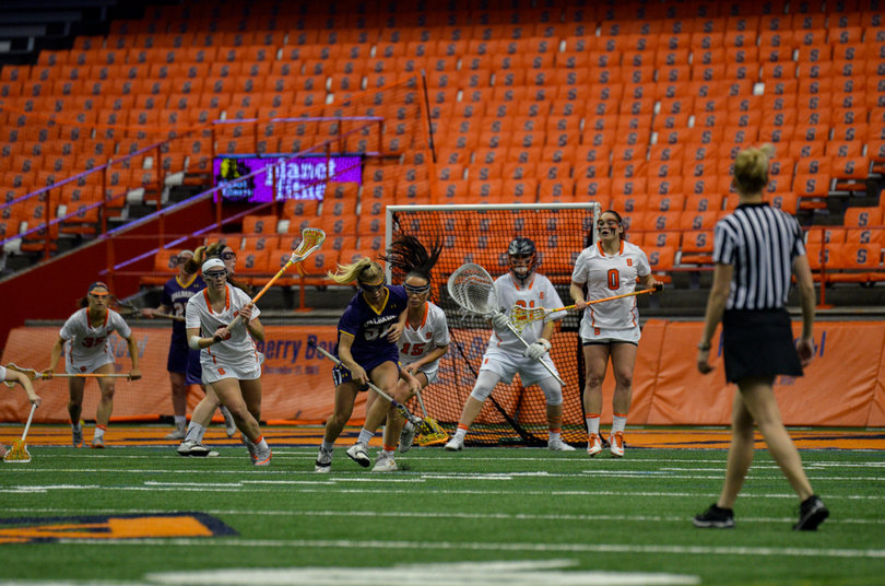 An Albany player tries to reset in front of the Orange goal. 