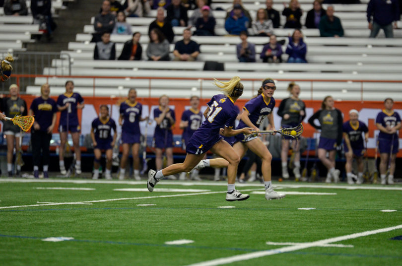 Albany's Dakotah Savitcheff runs up the field. 