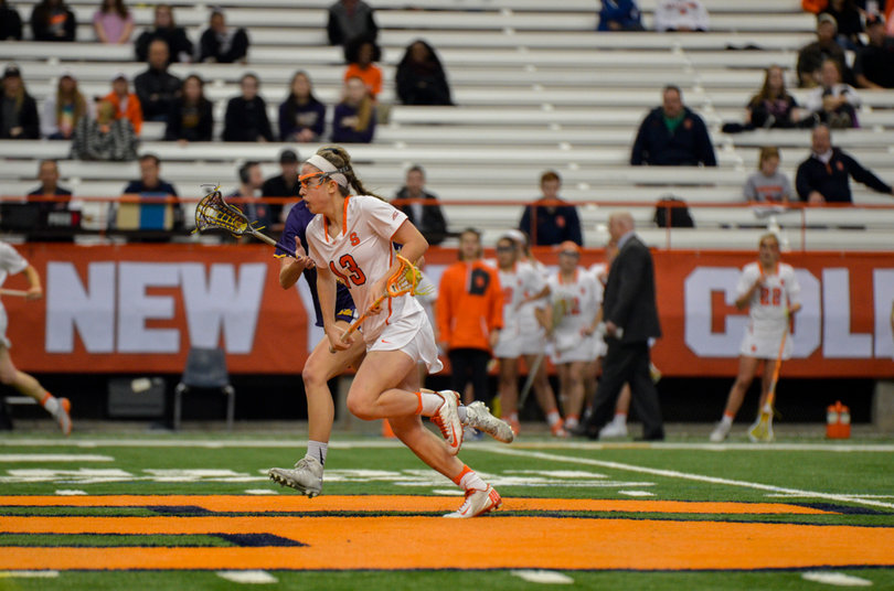 Lila Nazarian works to clear the ball