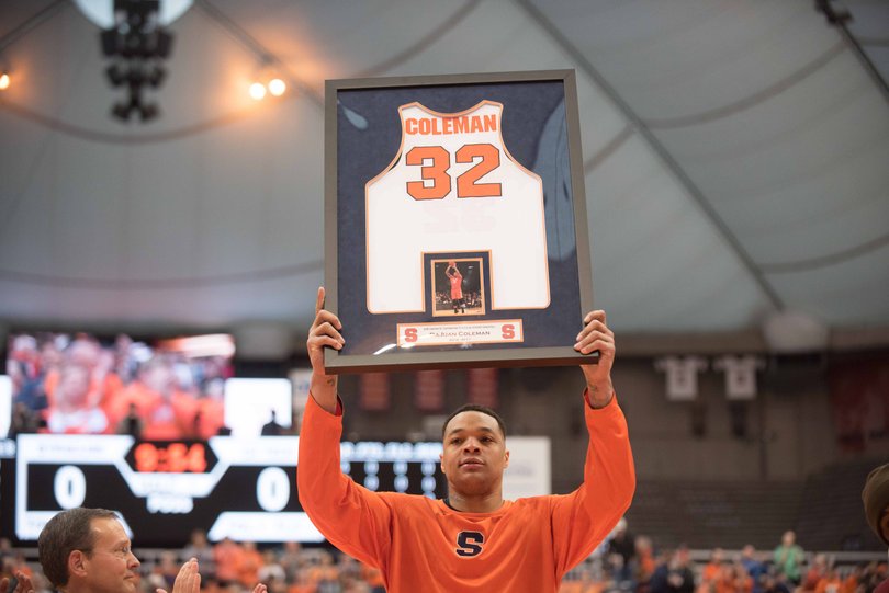 Dajuan Coleman, who has played more than 20 minutes just five times all year, holds up his jersey. 