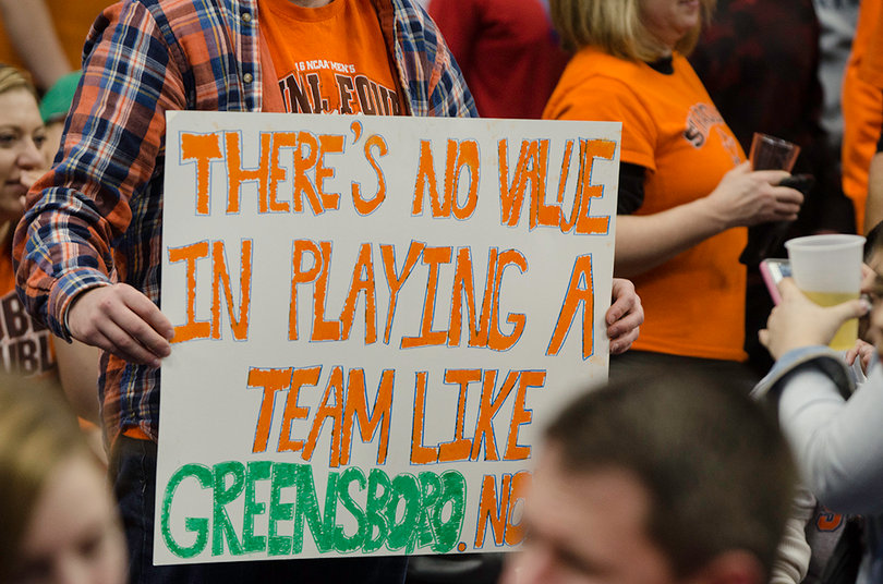 A fan in the Dome points out that Boeheim and the city of Greensboro squashed beef earlier this week. 
