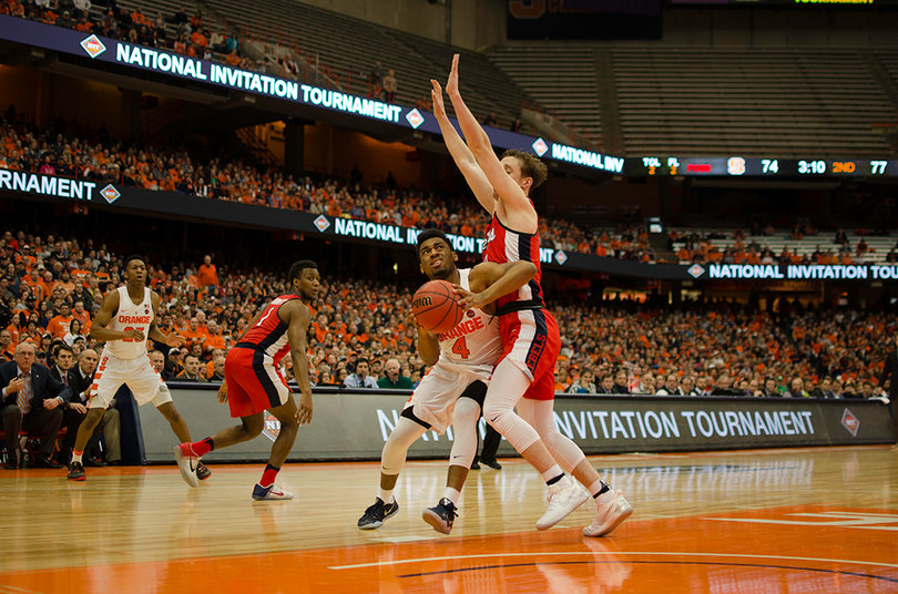 Gillon tries fighting his way inside against a Mississippi defender. Gillon's play dropped off in the National Invitation Tournament.