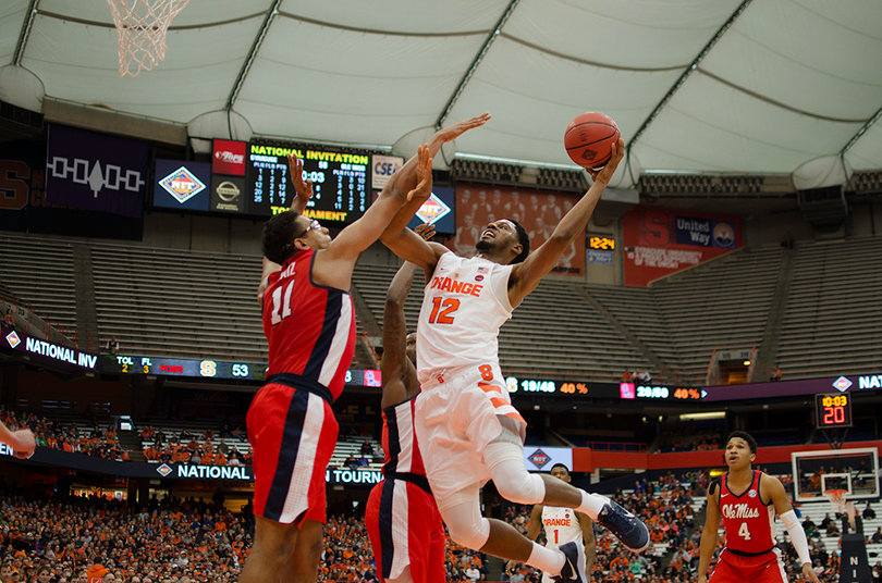 Freshman center Taurean Thompson attacks the rim with a left-handed shot in traffic. Thompson tied for a Syracuse game-high 18 points.