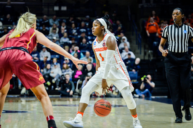 Peterson dribbles between her legs.